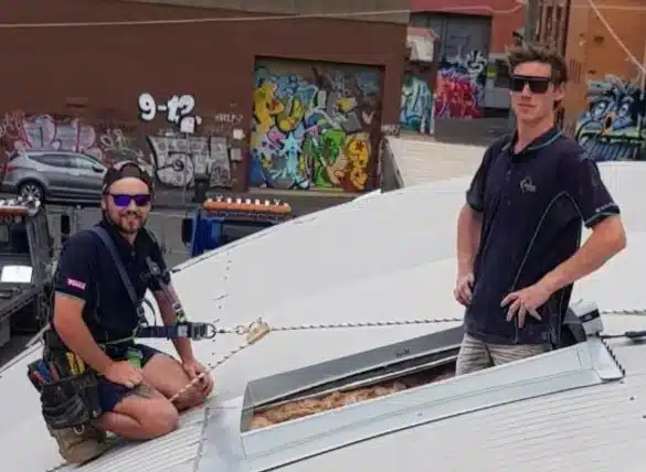 Experienced skylights installers showing off theirs skills on an inner city curved roof